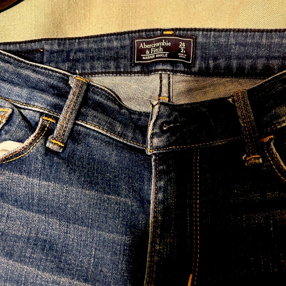 Abercrombie and Fitch capris , slightly stressed .